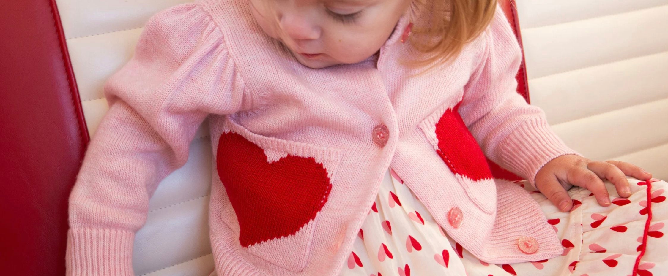 girl in heart sweater