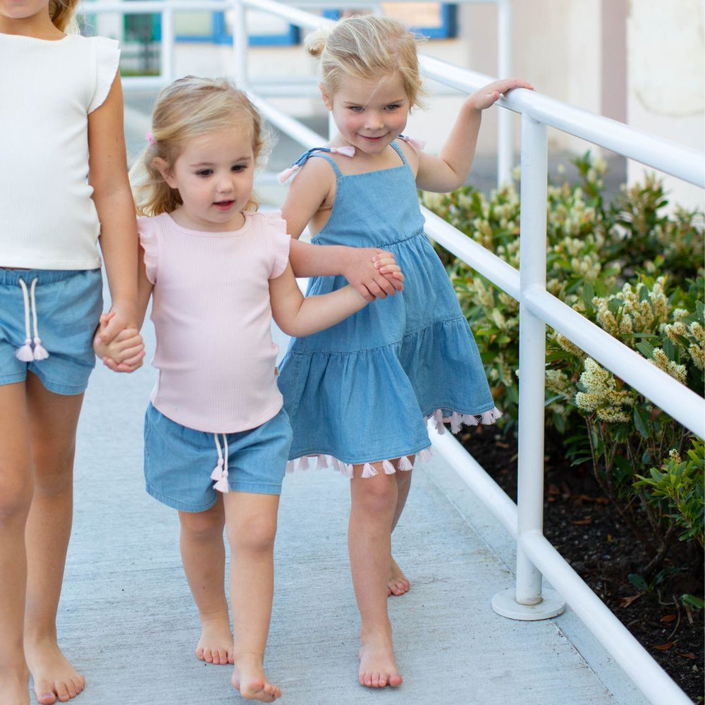 little girl wearing ryan shorts