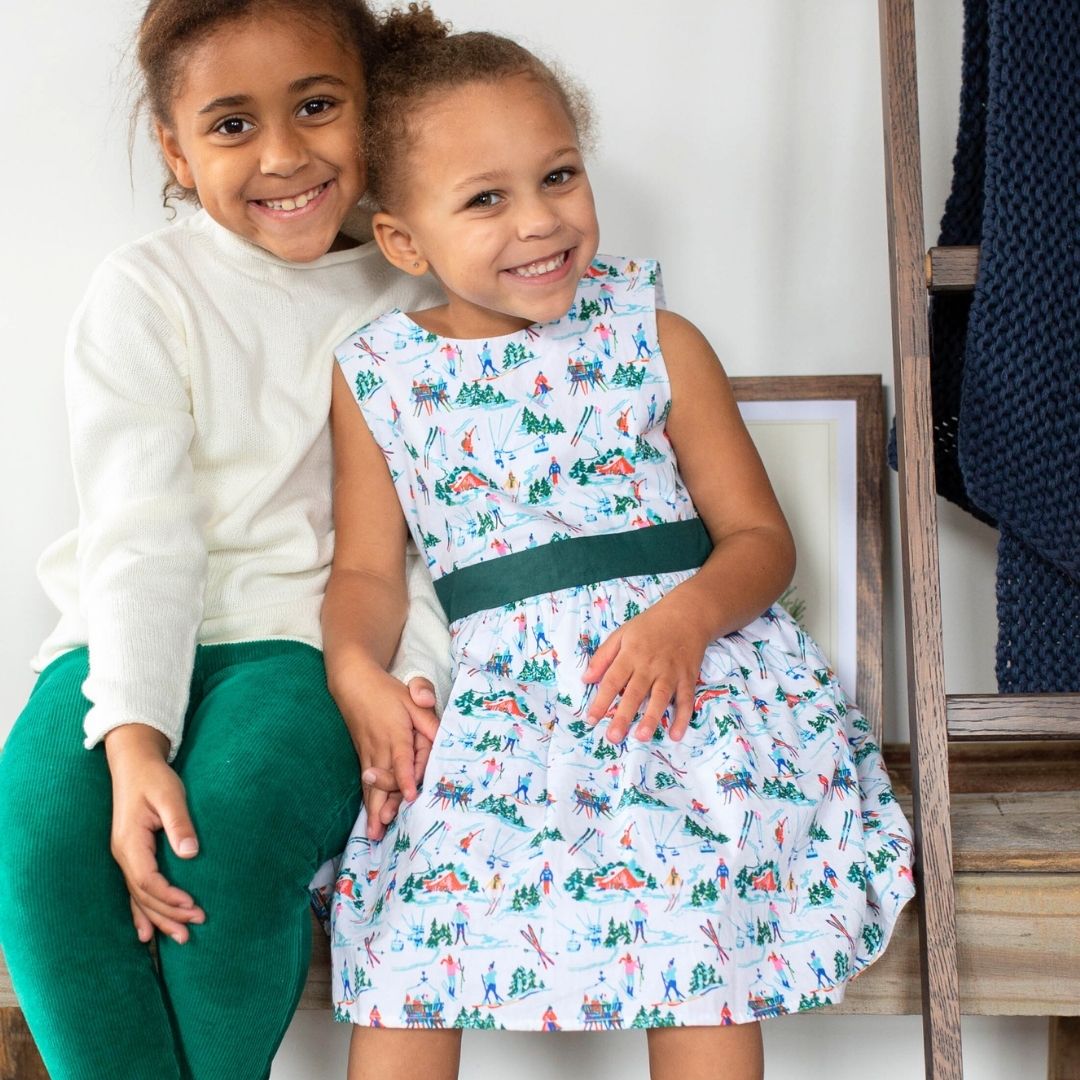 girls wearing sweater and vivienne dress