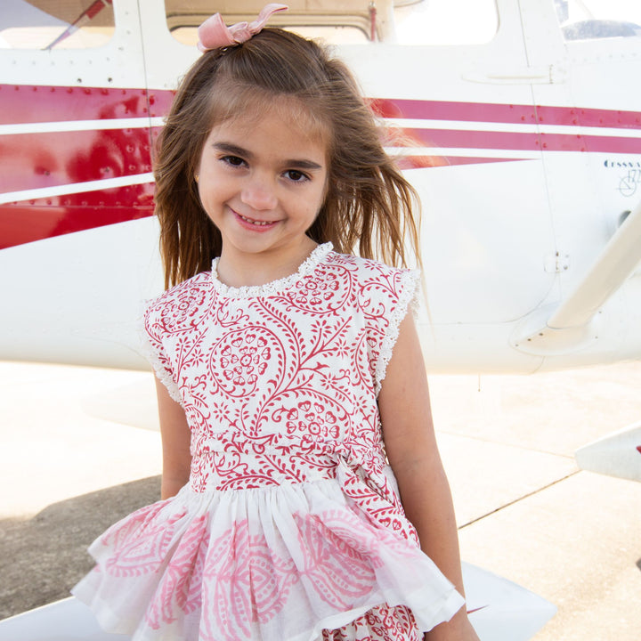 Girl in dress on tar mac