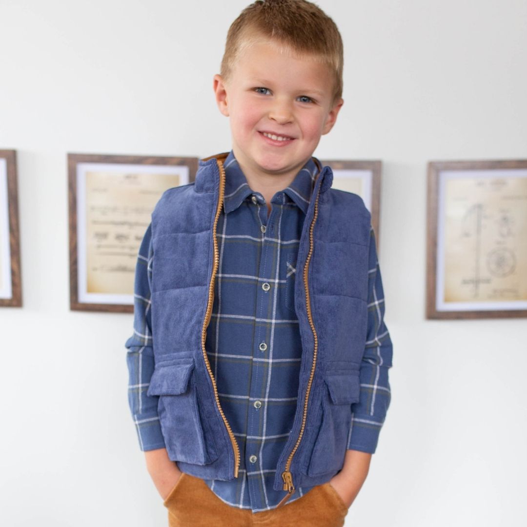 boy wearing navy flannel with navy vest