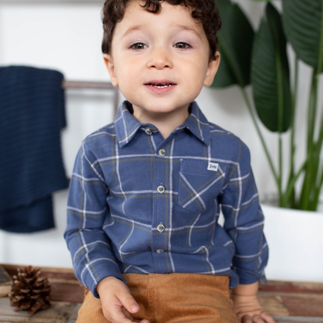 boy wearing navy blue flannel