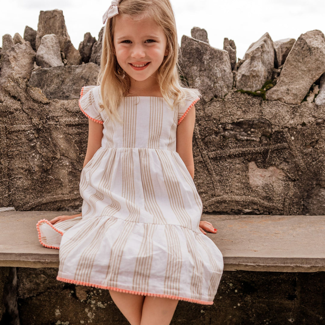 Lulu Dress on girl sitting on bench