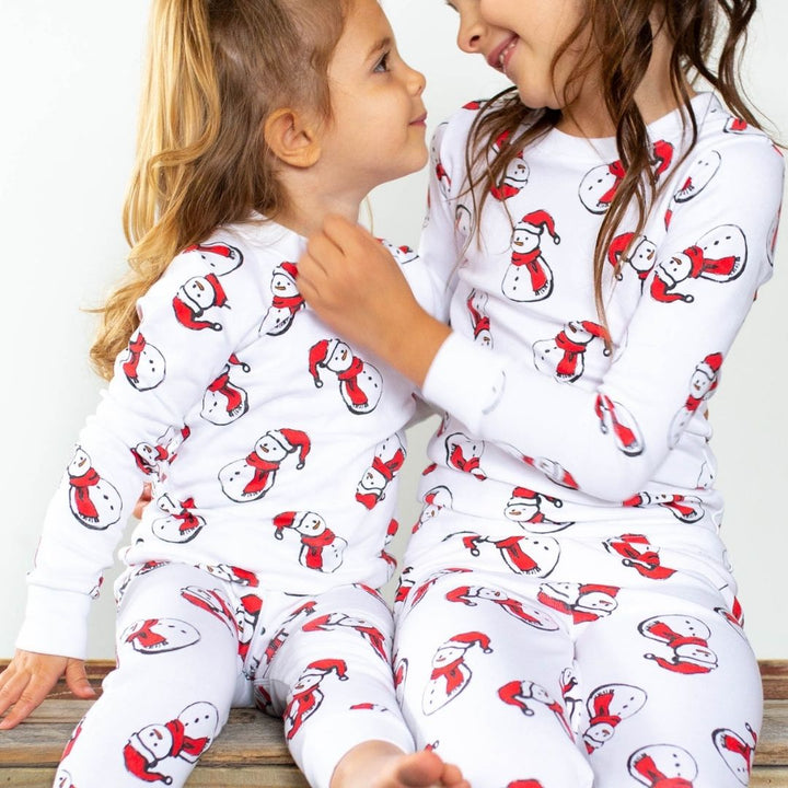 girls wearing snowman pajams