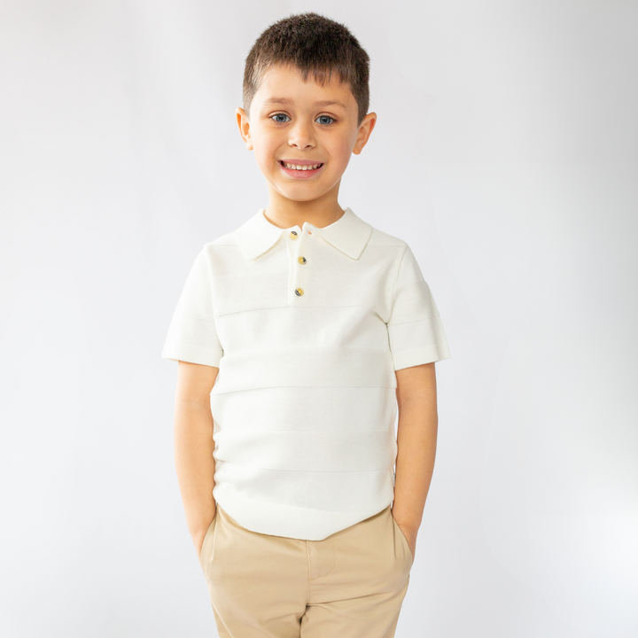 a little boy wearing Aiden Knit Polo in Angel White