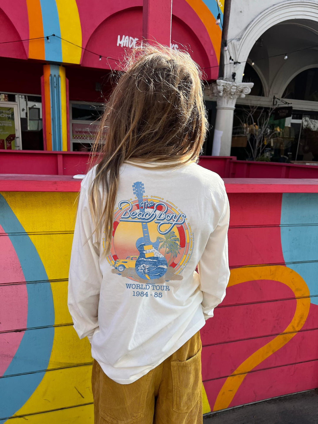 girl wearing beach boys shirt