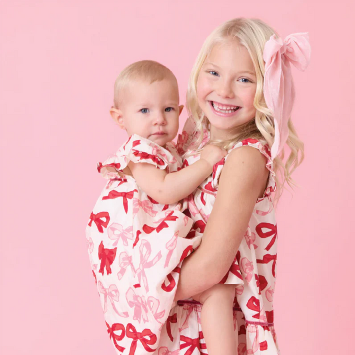 a baby wearing Baby Camelia Dress Set - Valentines Bows