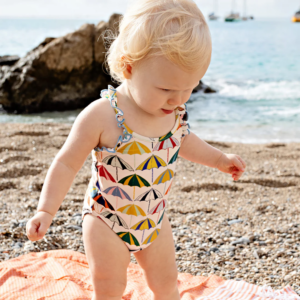 a baby wearing Baby Claire Suit - Multi Umbrellas