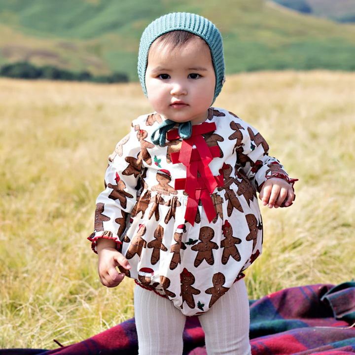 a baby wearing Baby Hermione Bubble - Gingerbread Cookie