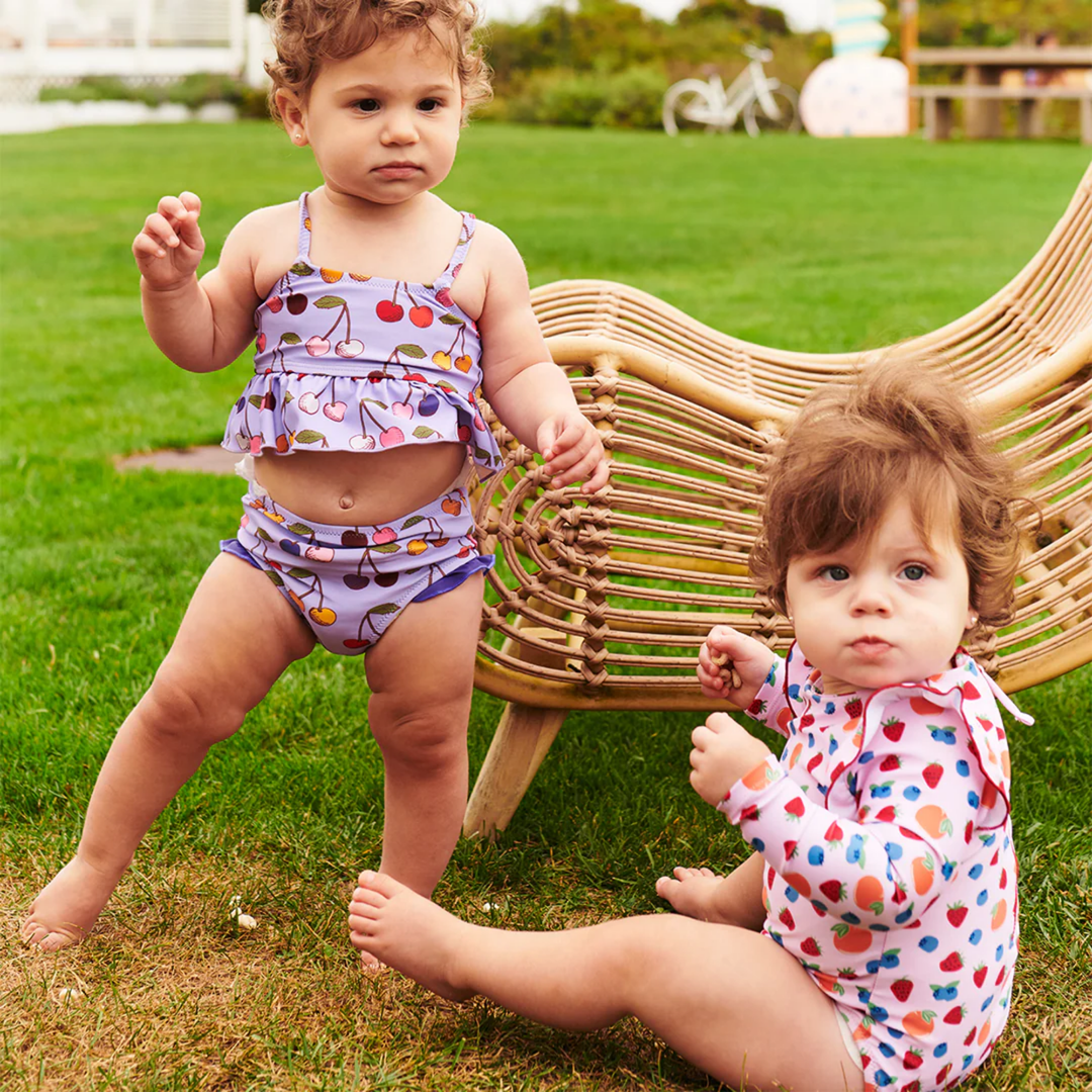 a baby wearing Baby Joy Tankini - Lavender Cherry