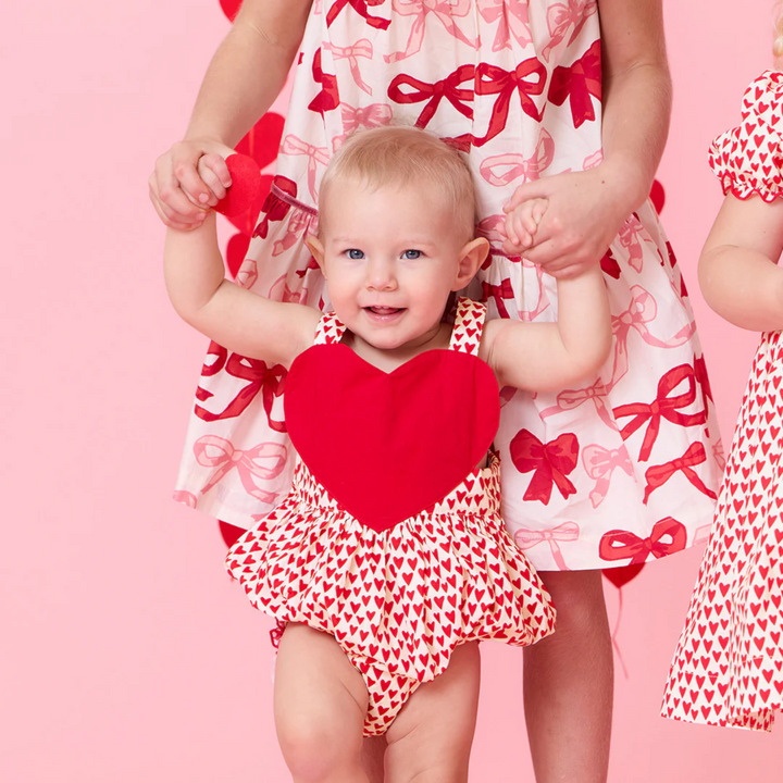 a baby wearing Baby Lucy Love Bubble - Mini Hearts