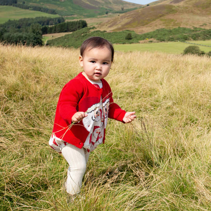 a baby wearing Baby Maude Sweater - Red Santa