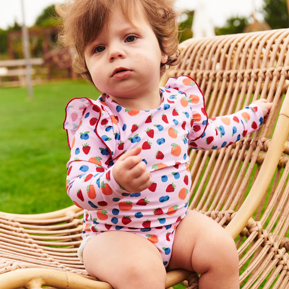 a baby wearing Baby Rachel Suit - Mixed Fruit