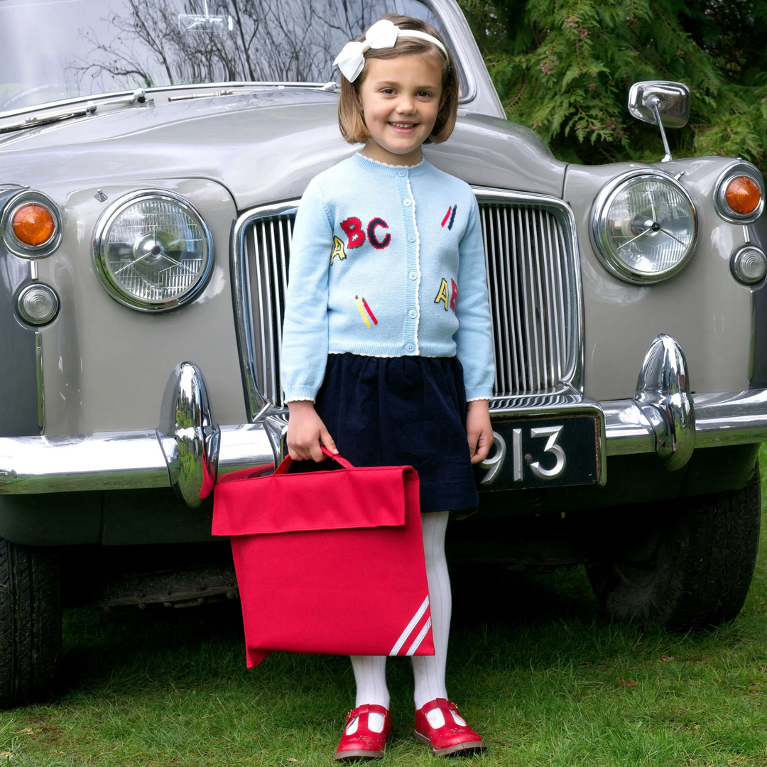 a girl wearing Babycord Pull on Skirt in Navy