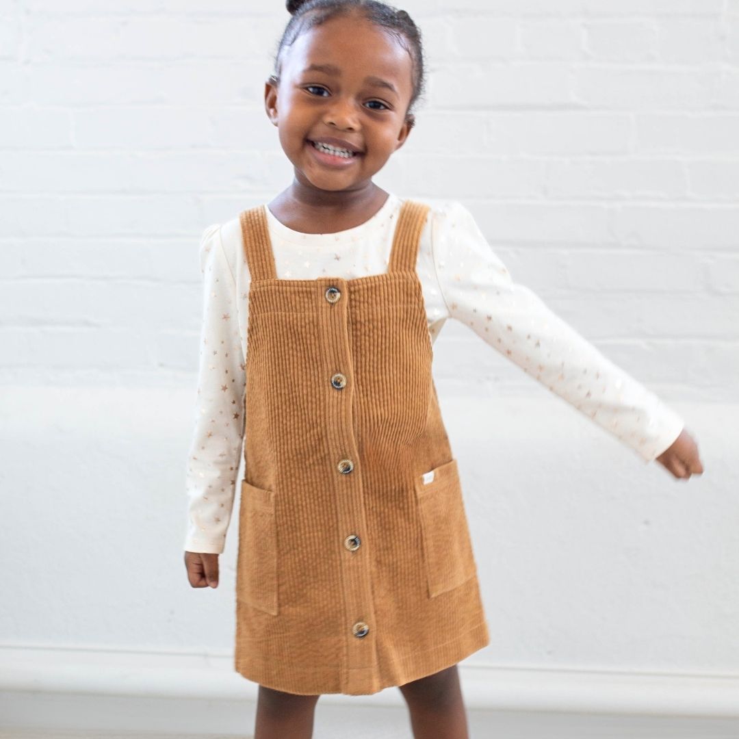 girl wearing brown cord jumper