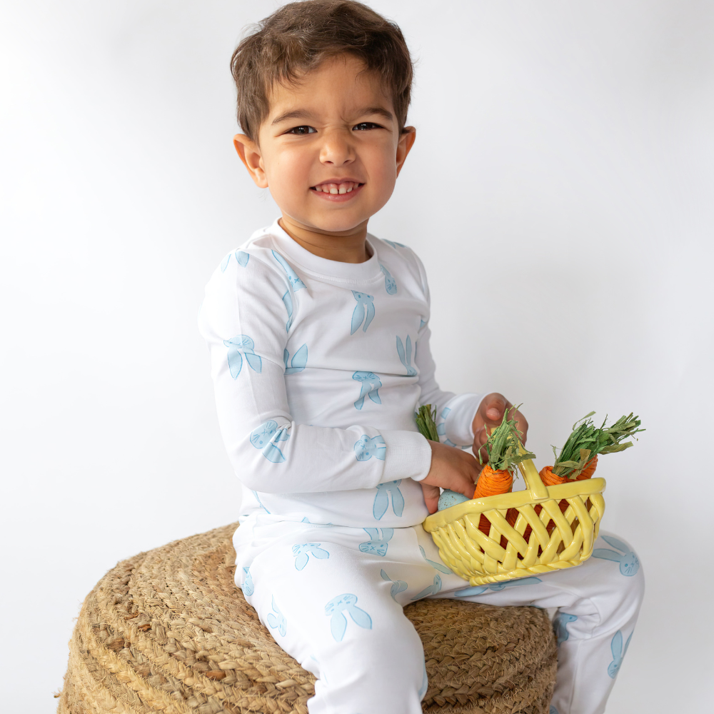 a little boy wearing Sweet Bunny Pajama Set in Blue