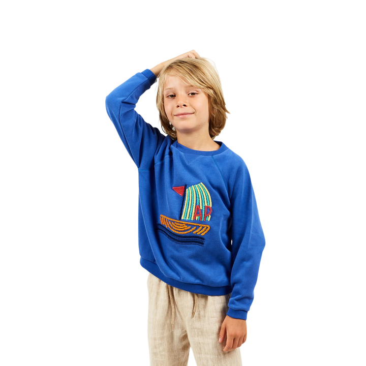 a boy wearing Boat Sweatshirt in Cobalt