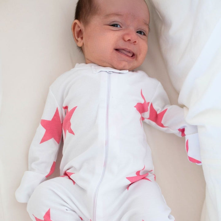 a baby wearing Bold Star Zipper Romper in Pink