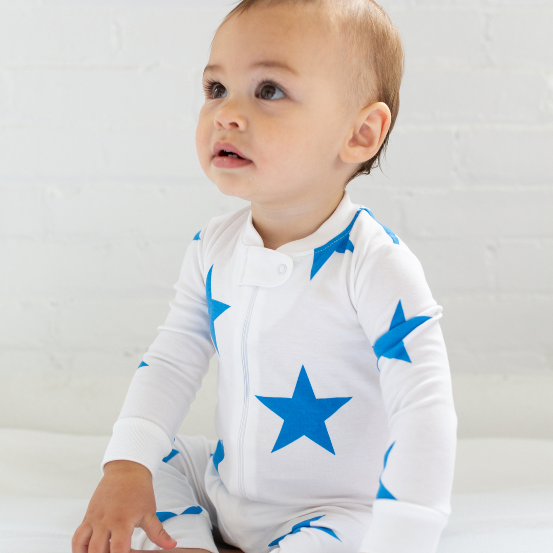 a baby wearing Bold Star Zipper Romper in Blue