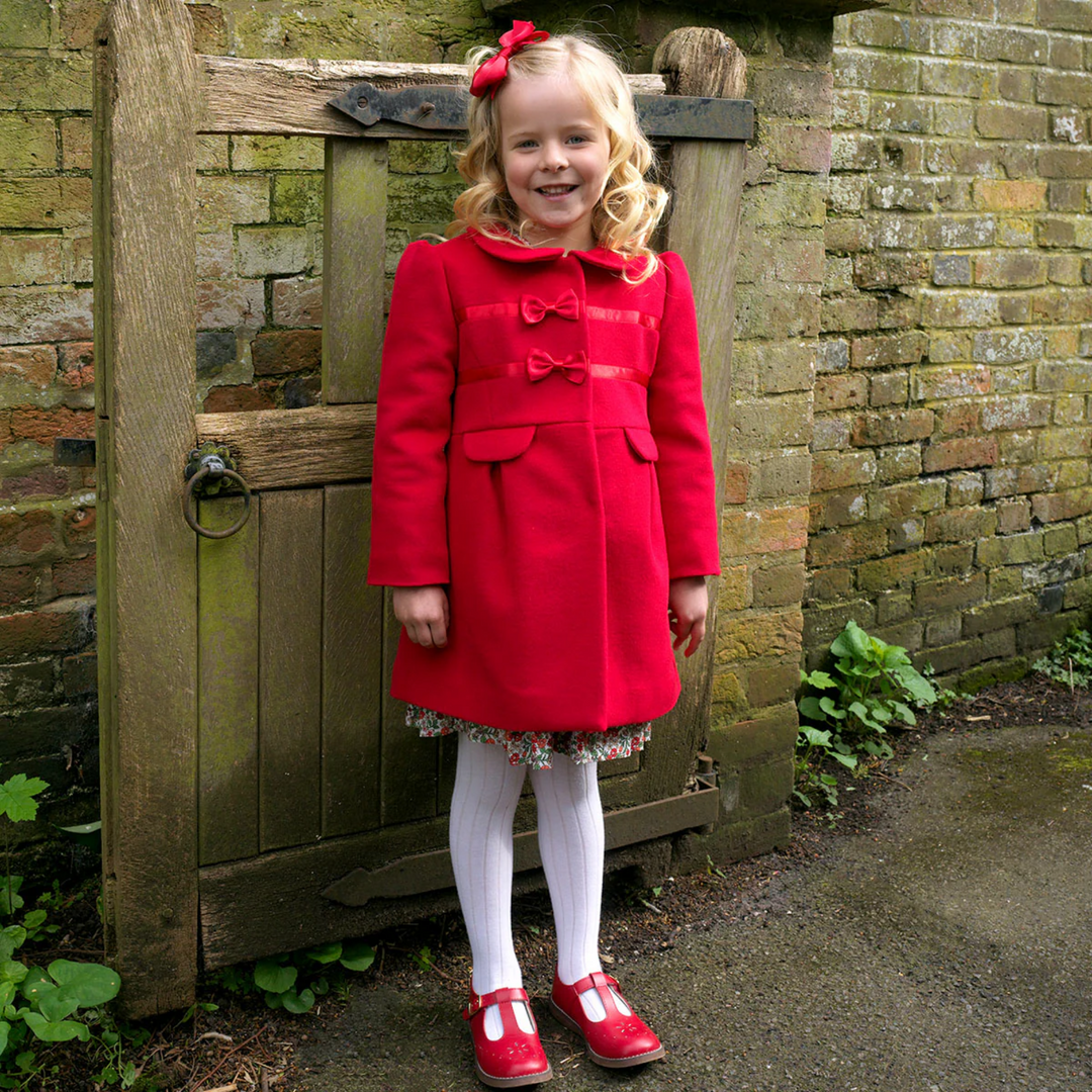 a girl wearing Bow Trim Coat in Red