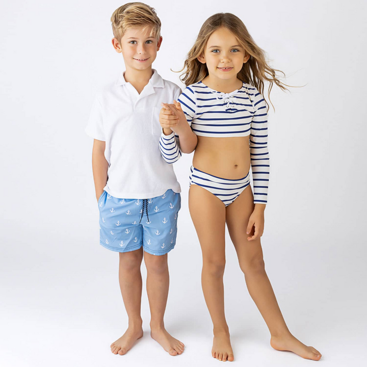 a boy wearing Embroidered Trunks in Blue Anchors