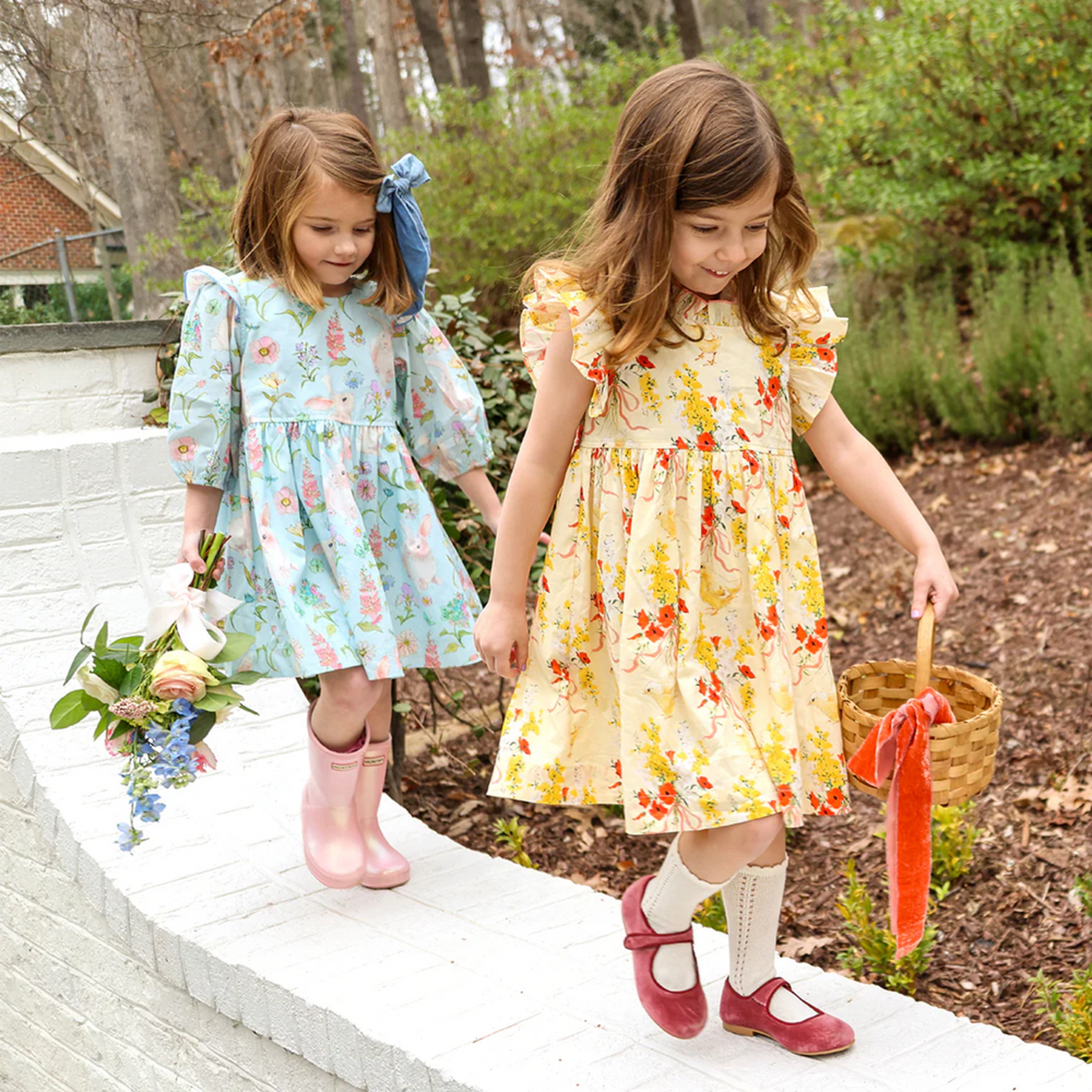 a girl wearing Brooke Dress - Botanical Bunnies