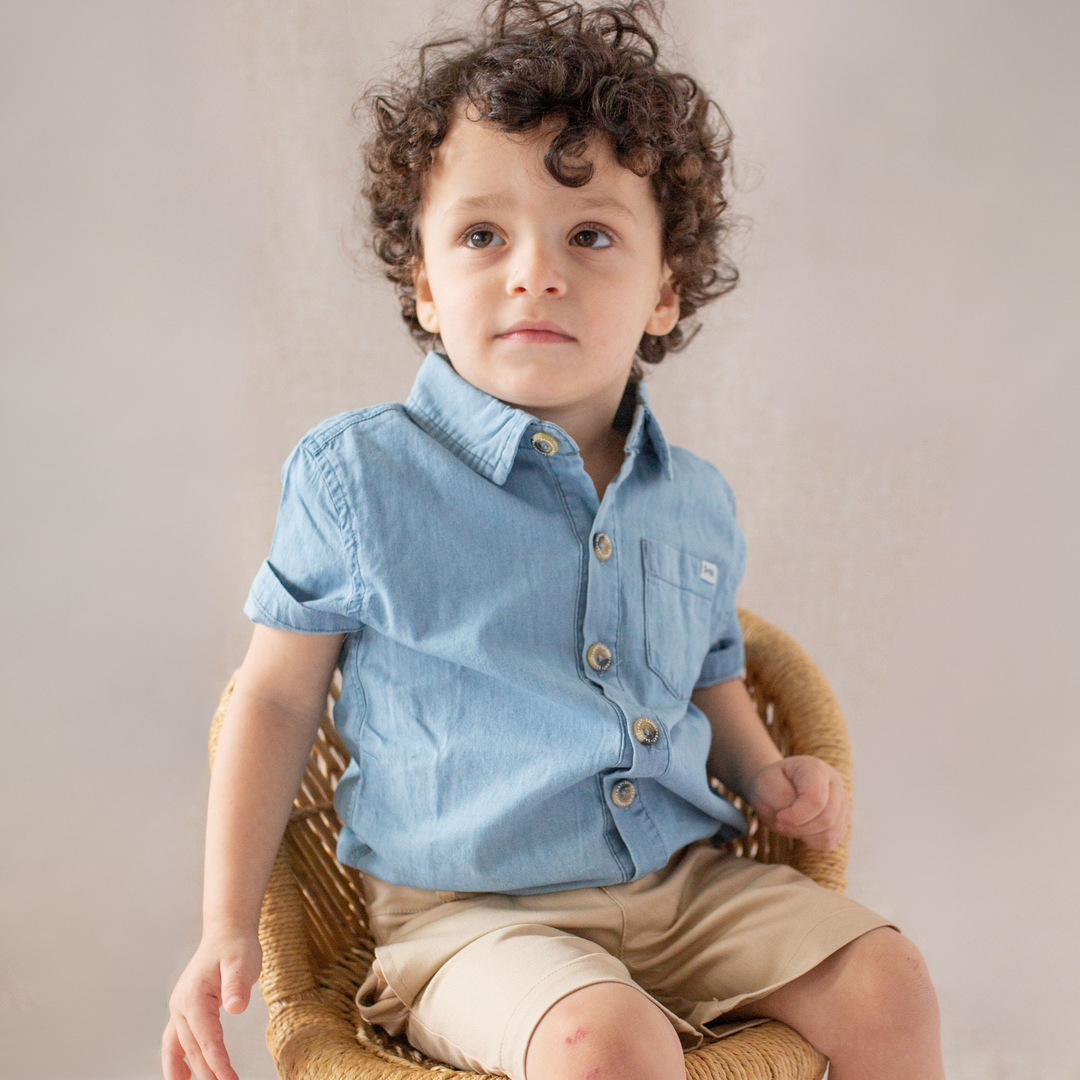 a little boy wearing Campbell Shirt in Light Wash Chambray