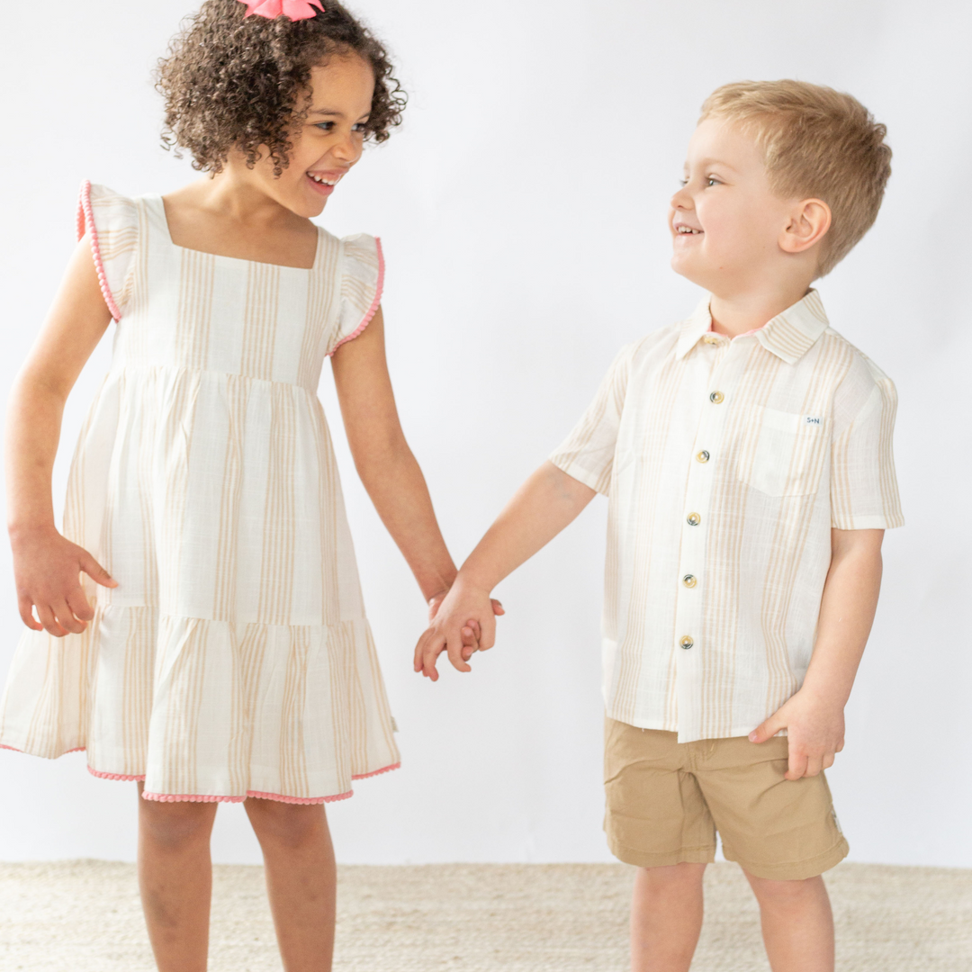 2 children holding each other wearing Campbell Linen Shirt in Desert Mirage Stripe 