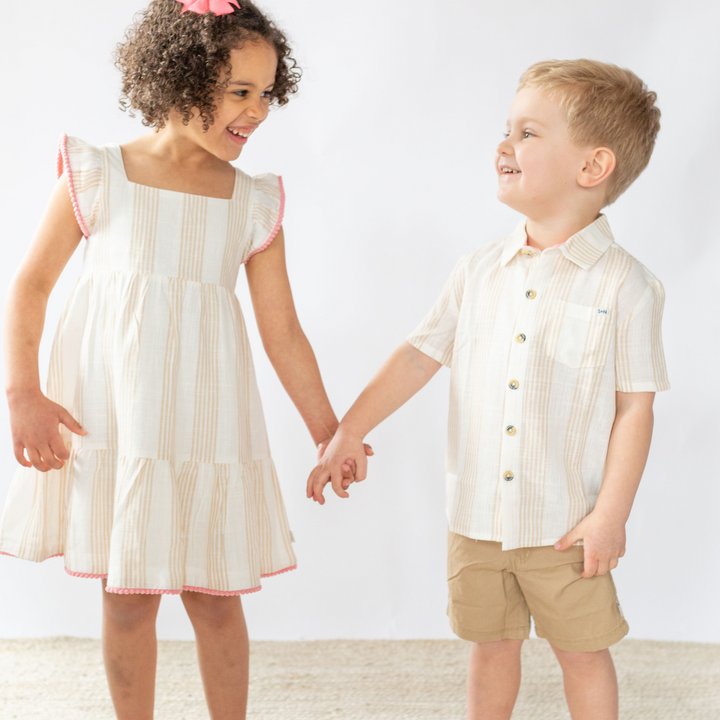 2 children holding each other wearing Campbell Linen Shirt in Desert Mirage Stripe 