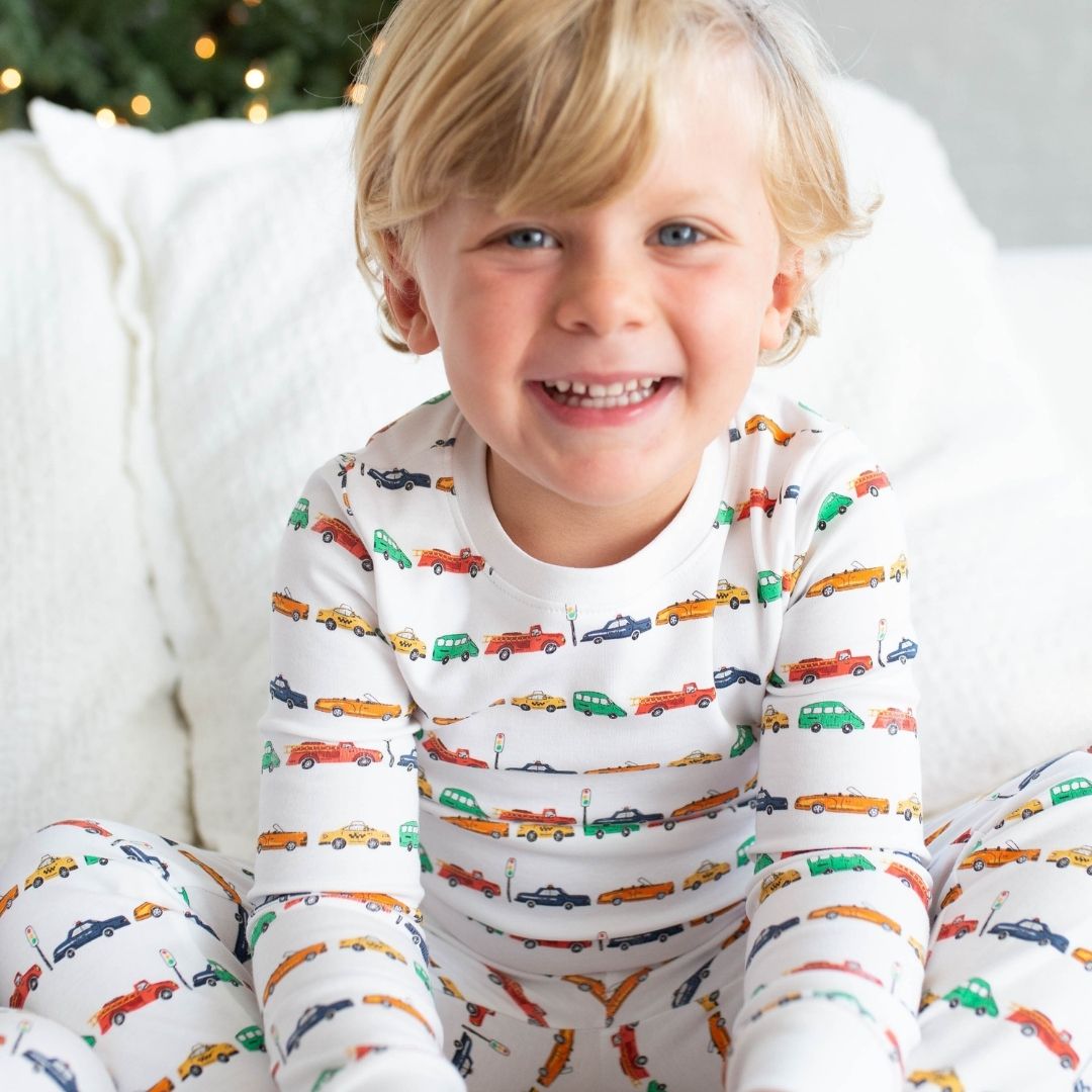 a boy wearing Car Parade Pajama Set