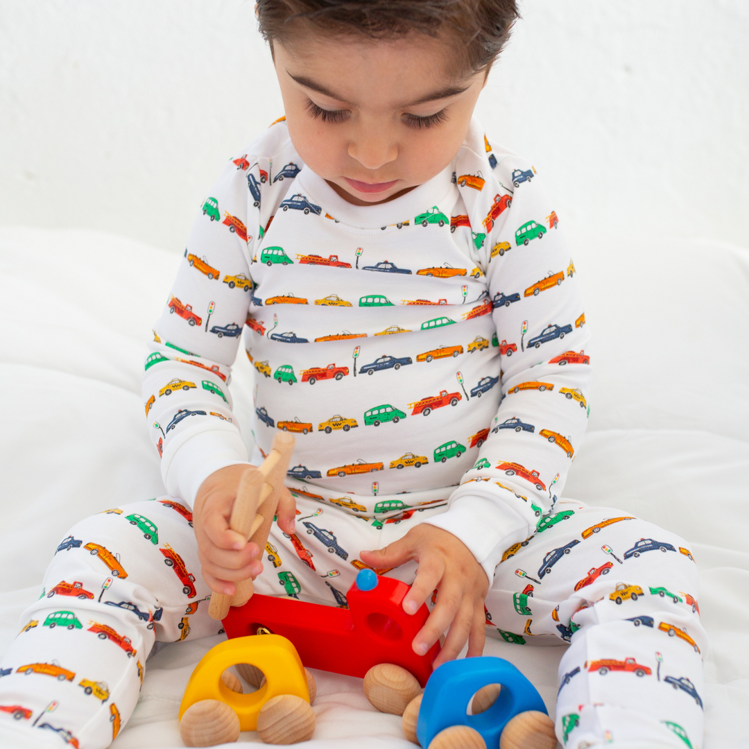 a little boy wearing Car Parade Pajama Set