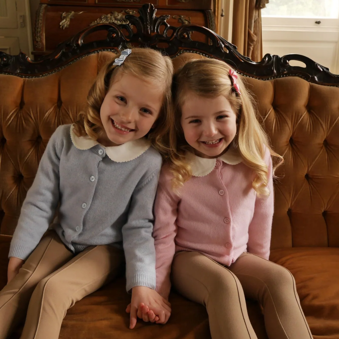 a little girls wearing Cashmere Cardigan in Pink