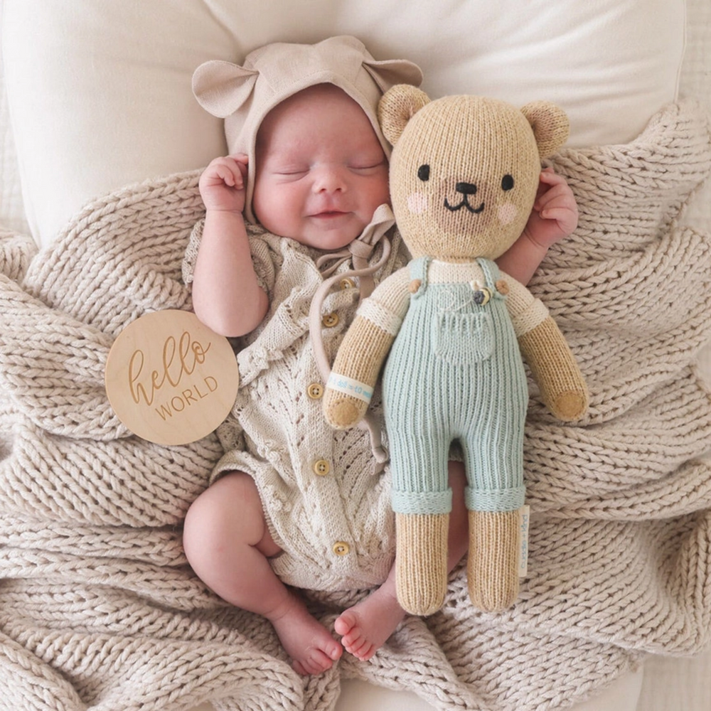 a baby with Charlie the Honey Bear