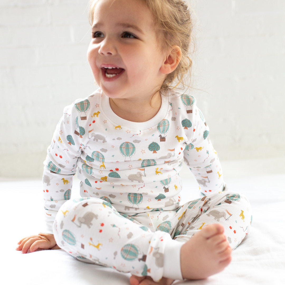 a little girl wearing Circus in the Sky Pajama Set