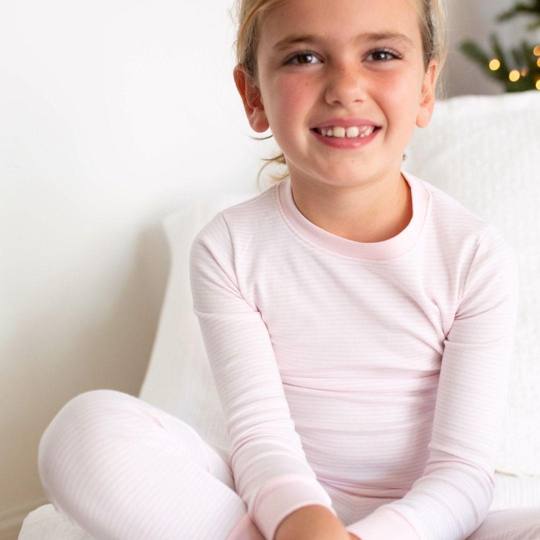 a girl wearing Classic Stripe Pajama Set in Pink