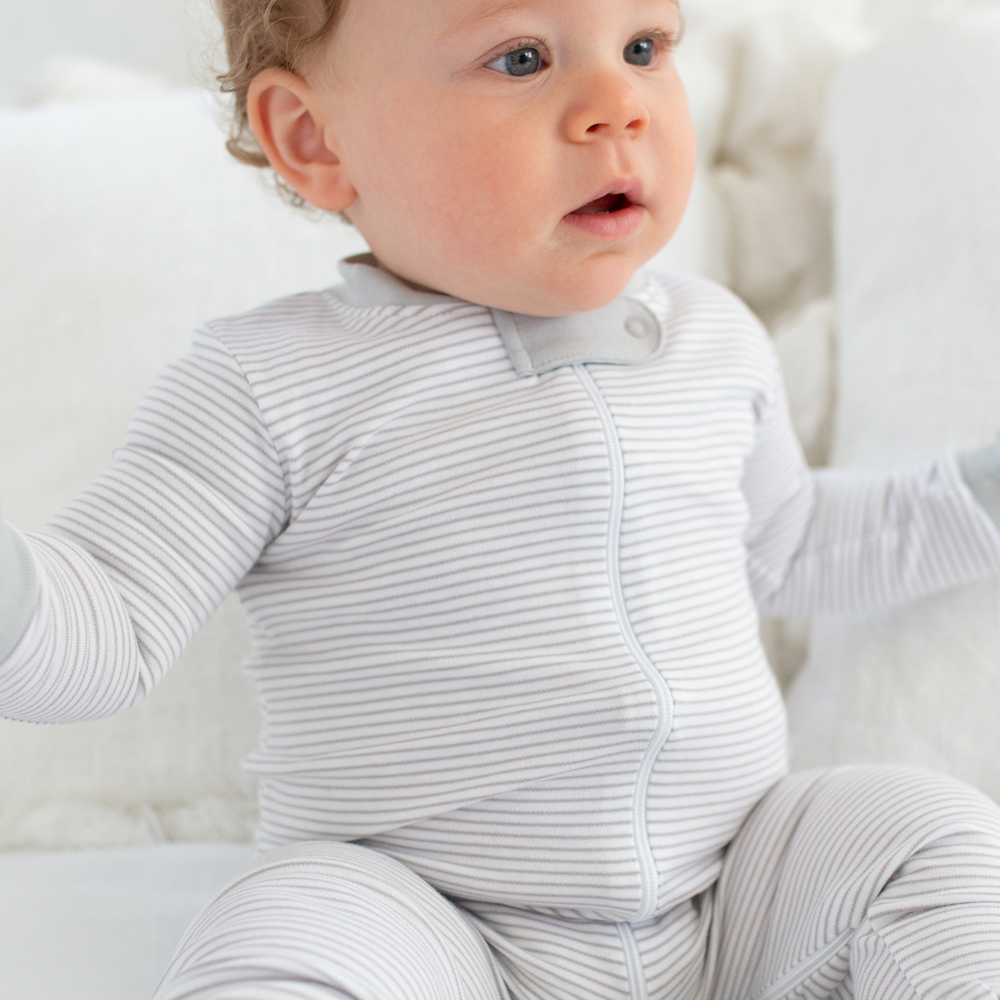 a baby wearing Classic Stripe Zipper Romper in Grey