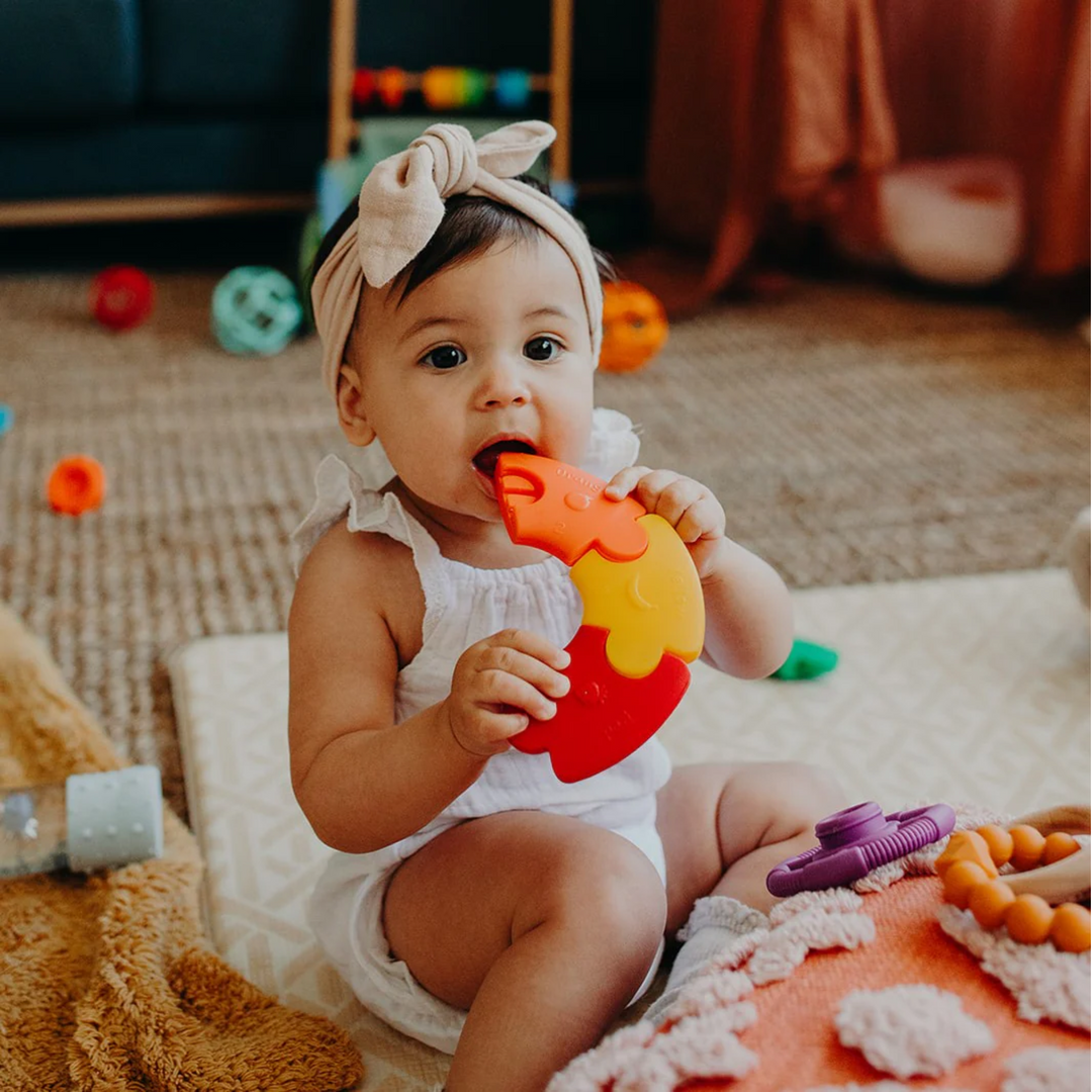 a baby playing Colour Wheel - Rainbow