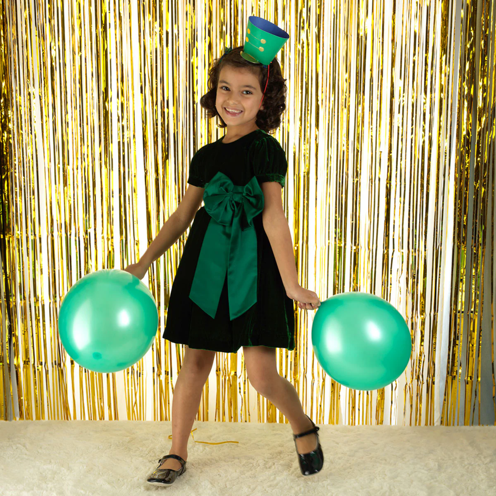 a girl wearing Crushed Velvet Bow Dress in Green