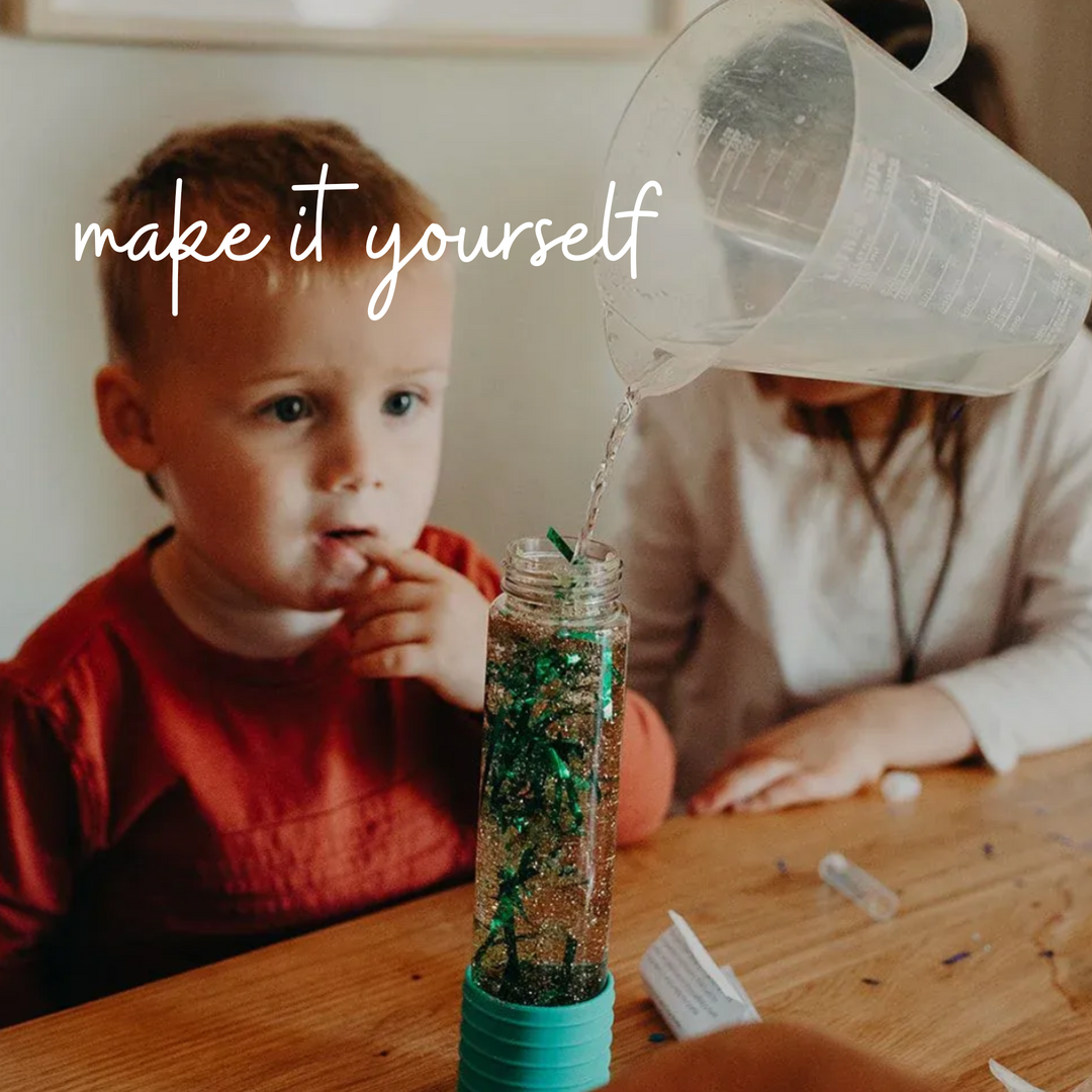 a boy playing DIY Calm Down Bottle Dino