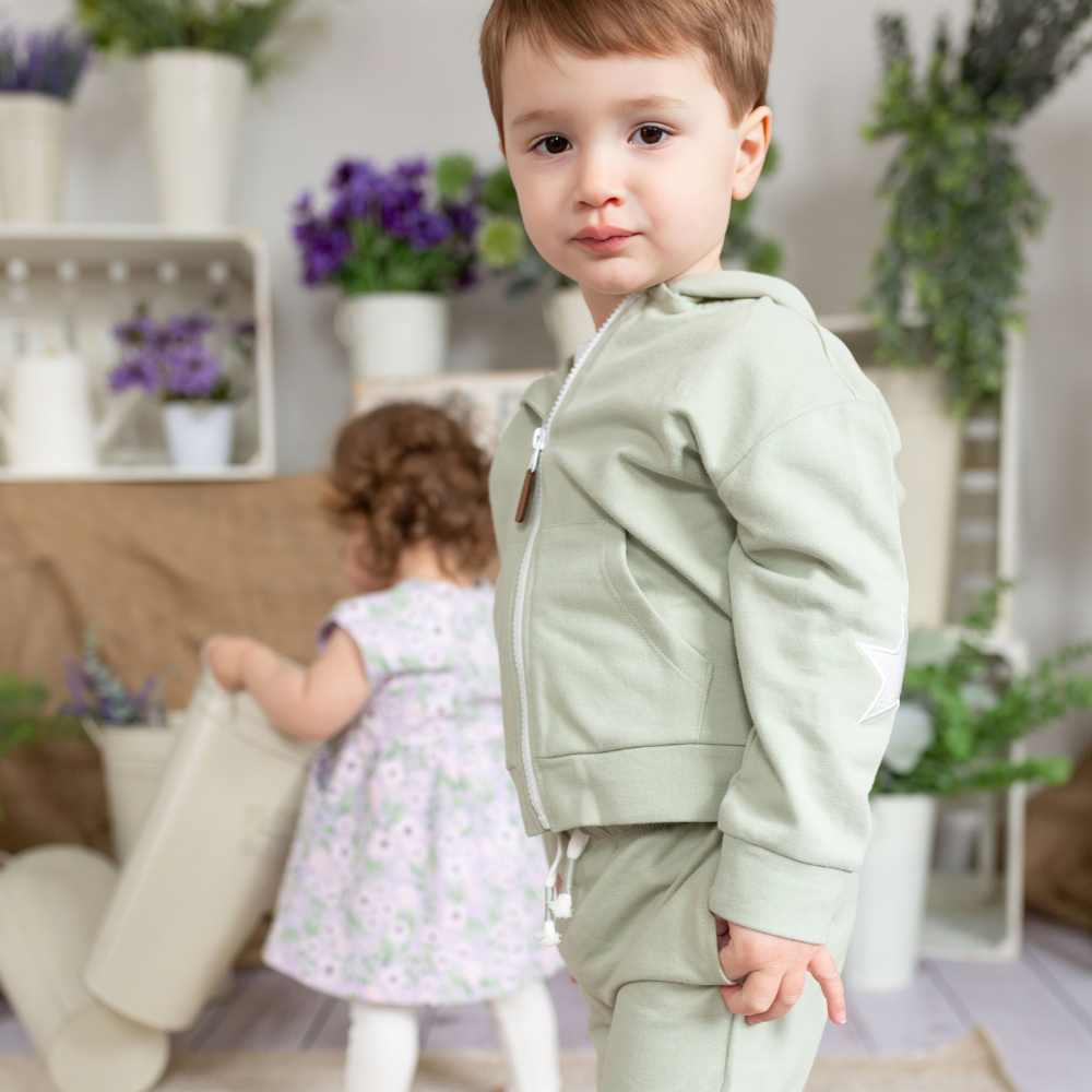 a boy wearing Dash Zip Sweatshirt in Desert Sage