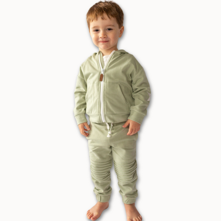 a little boy wearing Dash Zip Sweatshirt in Desert Sage