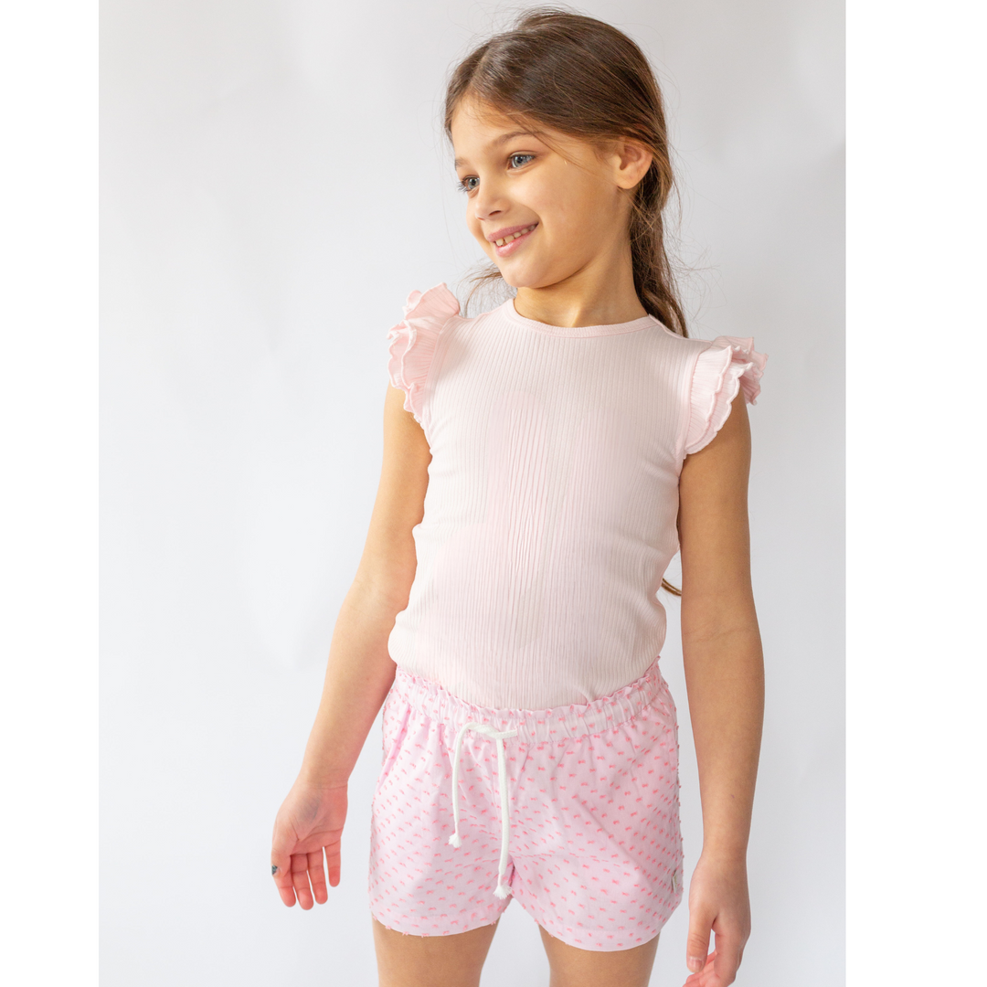 a little girl wearing Elsa Flutter Tank in Ballet Slipper