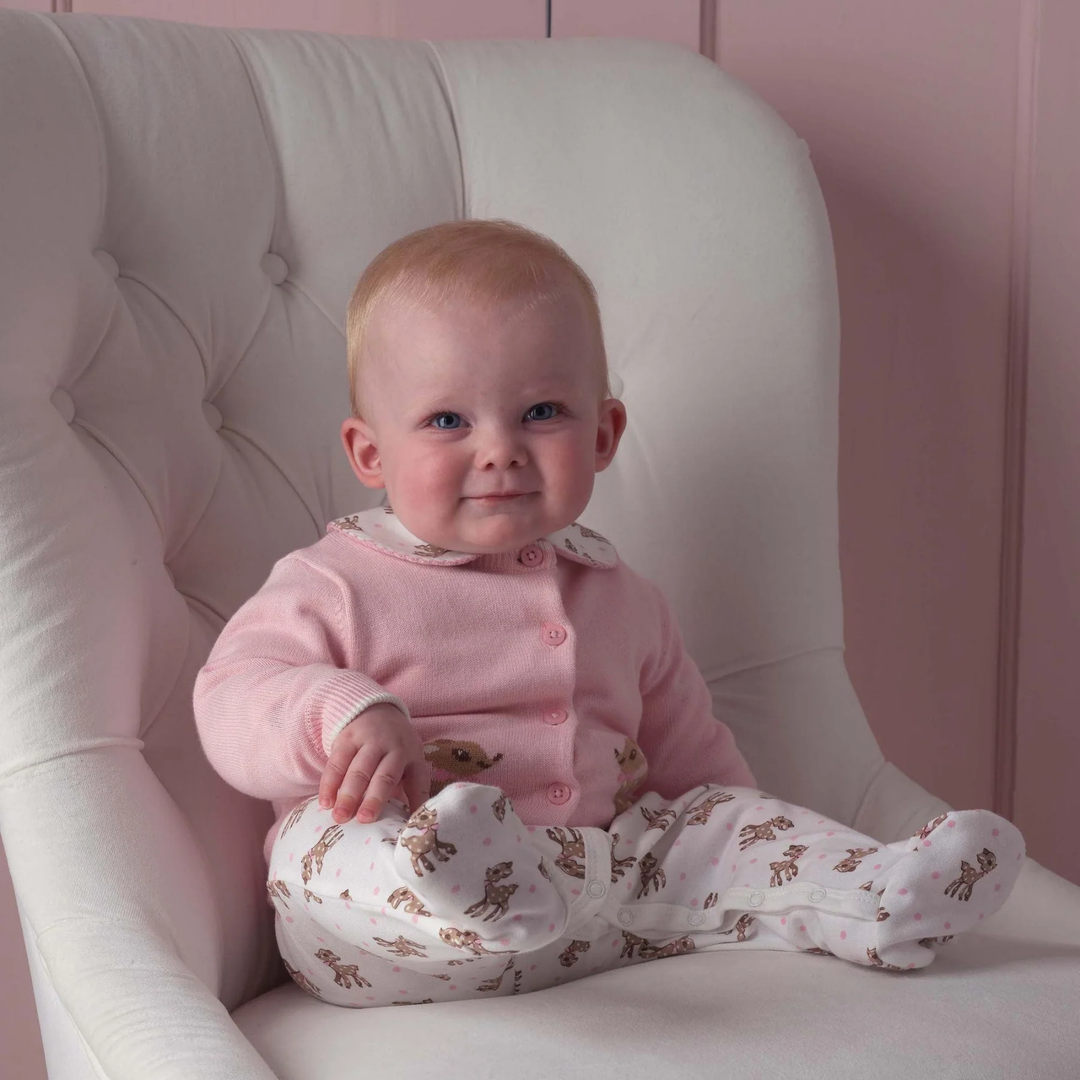 a baby girl wearing Fawn Cardigan in Pink