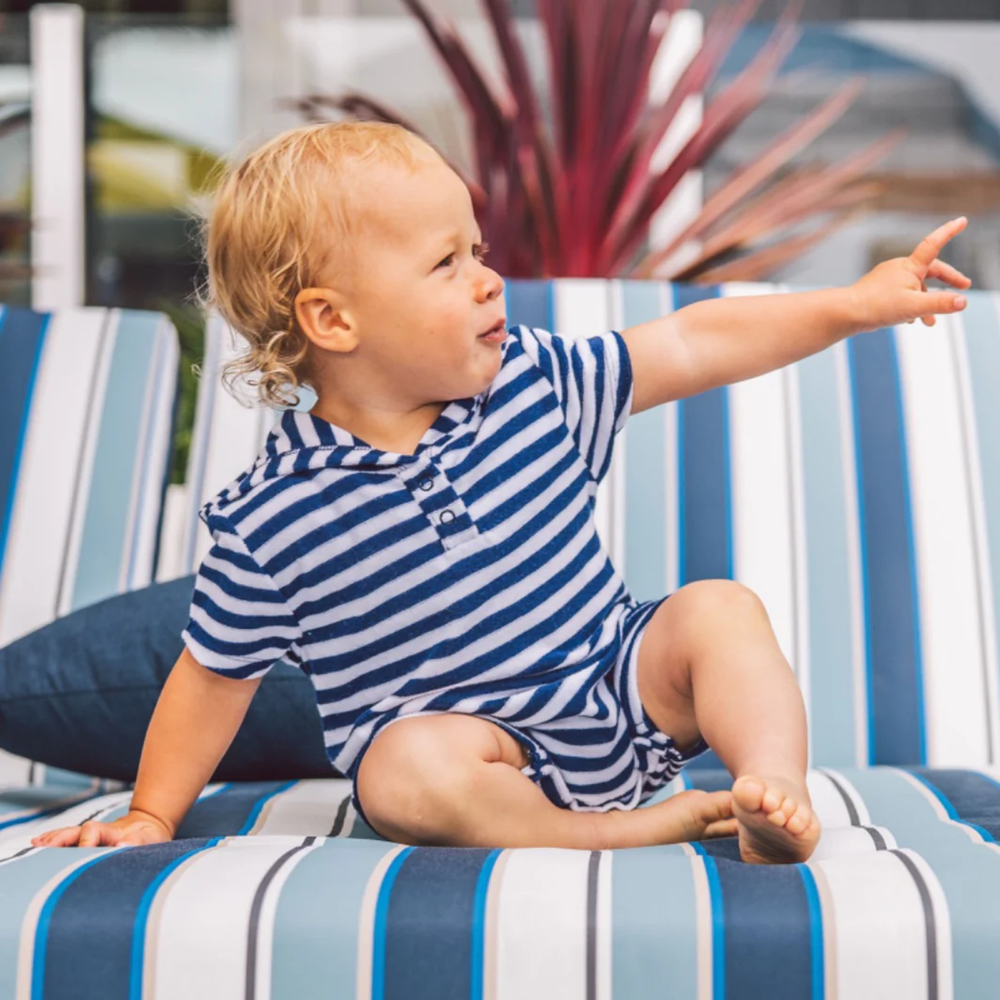 a baby wearing Finn Baby Hooded Romper in Navy and White Stripe