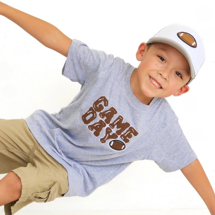 a boy wearing Football Patch Trucker Hat in Gray