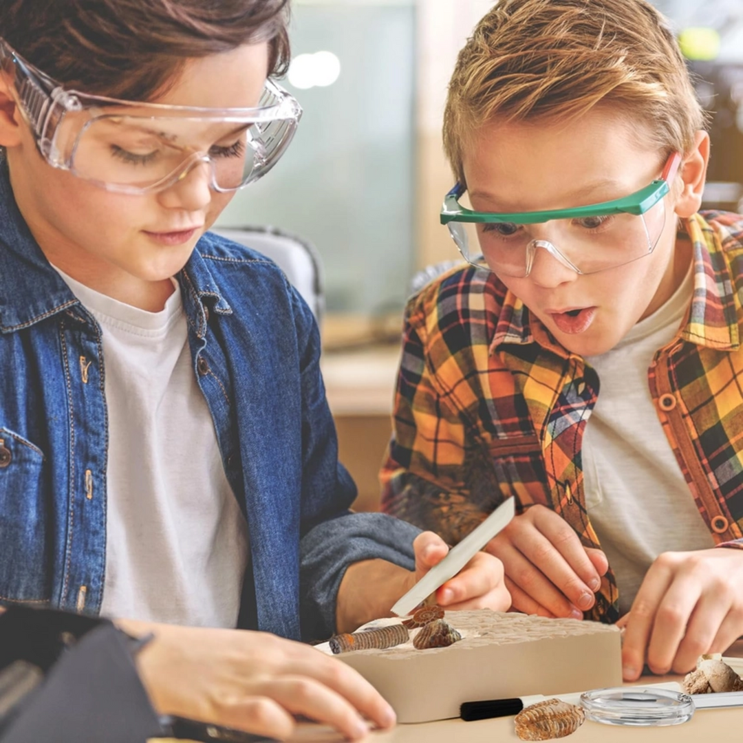 Fossil Dig Kit a boy and a girl wearing eye shield