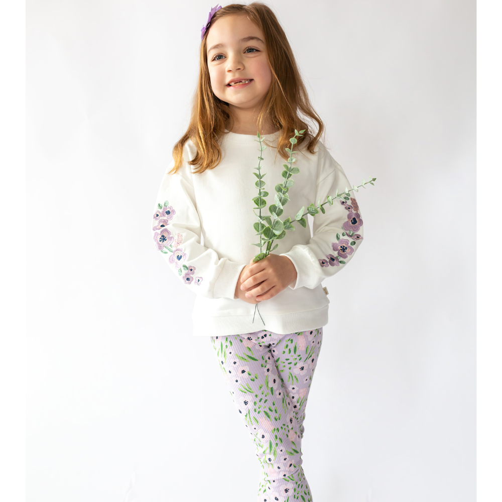 Frankie Sweatshirt with Lavender Flowers a girl holding a leaves