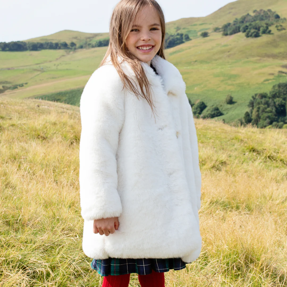 a girl wearing Fur Kate Coat - Snow White