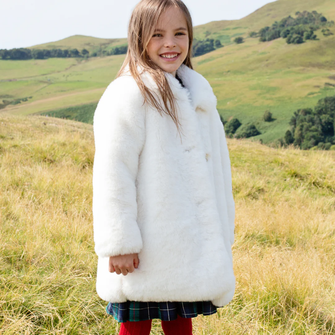 a girl wearing Fur Kate Coat - Snow White