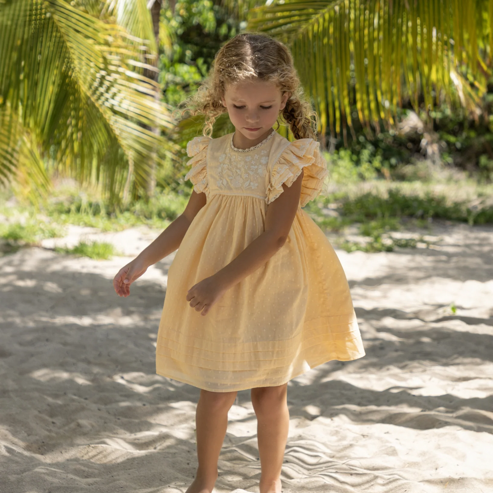 a girl wearing Georgia Dress in Vanilla